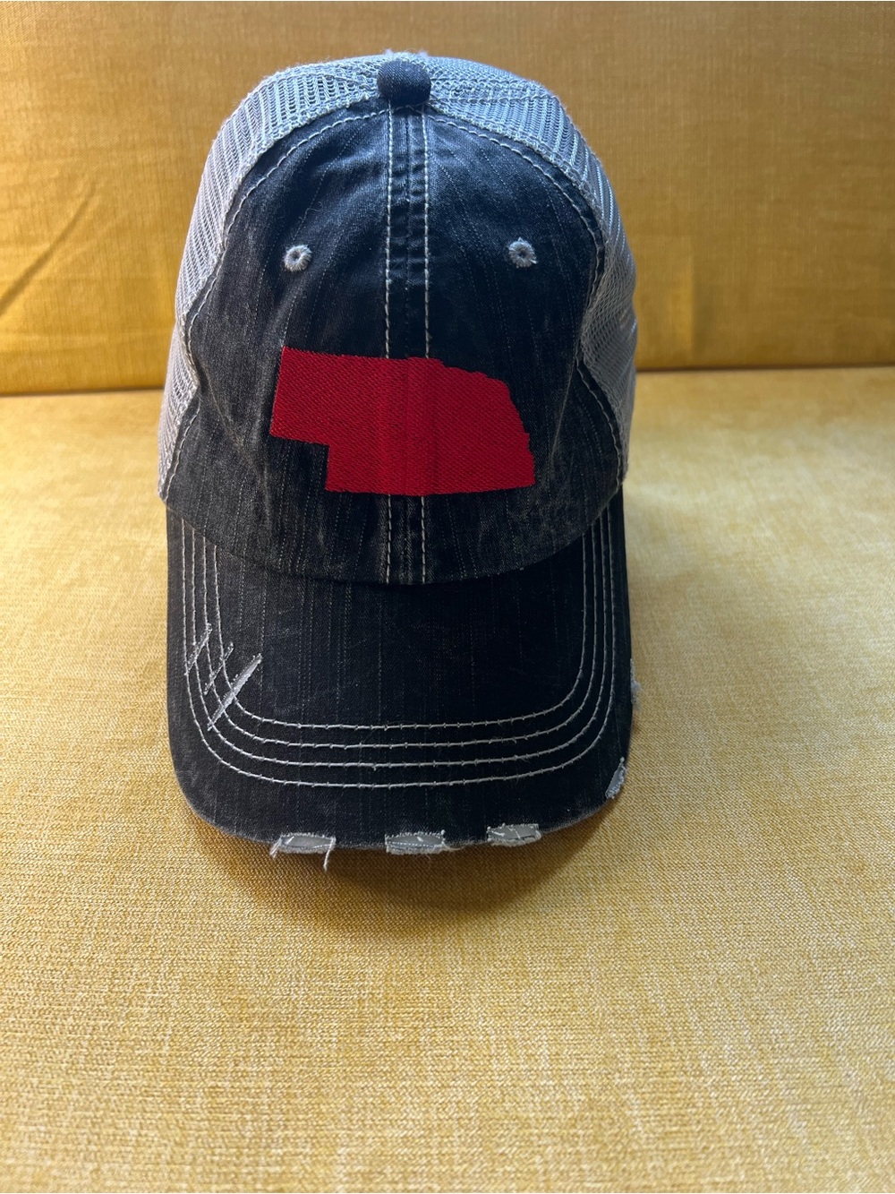 Black Distressed Trucker Hat with NE State Patch